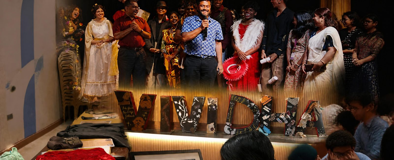 Students and faculty on stage at Vividha, the intercollegiate literary festival